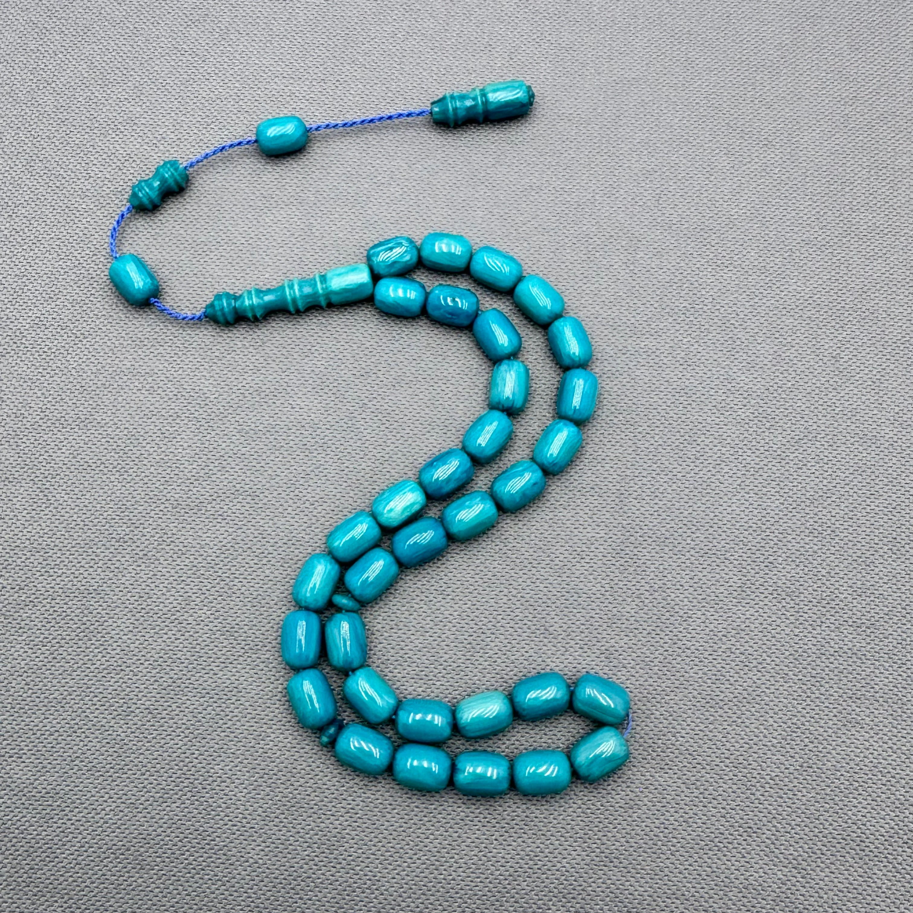 Usta İşçilikli Hareli Turkuaz Renk Dik Damarlı Kapsül Kesim Sıkma Kehribar Tespih